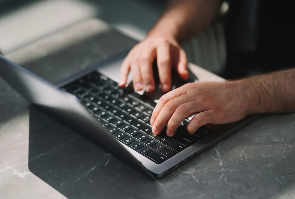 Person performing WordPress website maintenance and updates on a laptop computer