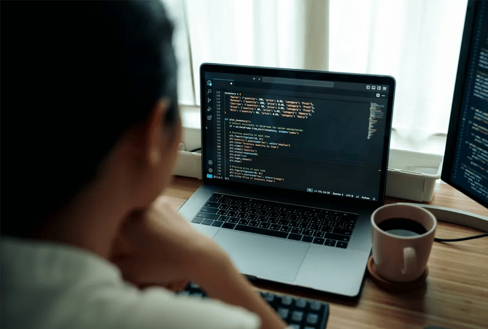 Developer reviewing website code to identify security vulnerabilities and recover from a hacking incident